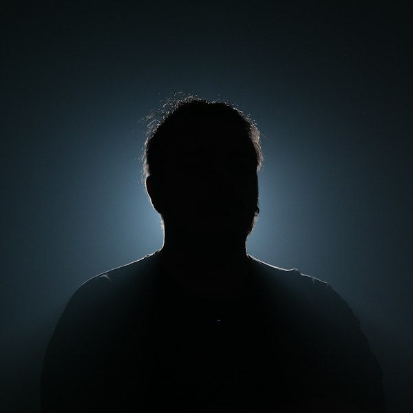 A silhouette hidden in darkness